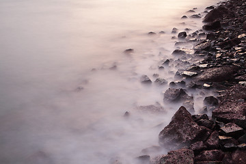 Image showing Sea coast wave and rock during sunset