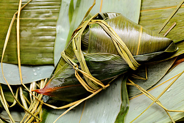 Image showing Rice dumpling on bamboo leaves