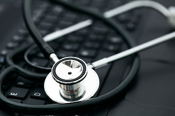 Image showing Stethoscope on computer keyboard