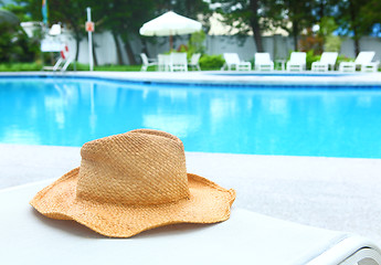 Image showing Wicker hat with swimming pool