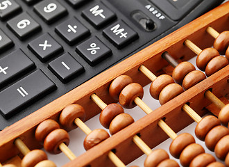 Image showing Ancient and modern calculator 