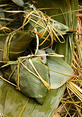 Image showing Rice dumpling on bamboo leaves