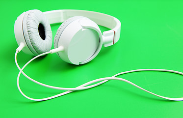 Image showing Headphone on green background