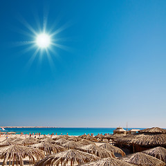 Image showing Lagoon and sunshades