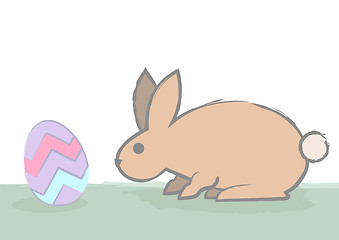 Image showing easter bunny sniffs egg