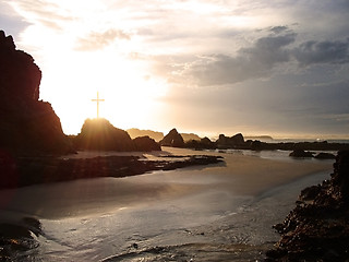 Image showing glowing cross by the sea