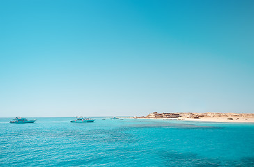 Image showing Clean sky and green water