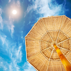 Image showing Beach sunshade under desert sun