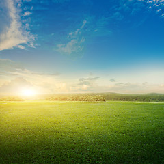 Image showing Meadow and clouds sunrise