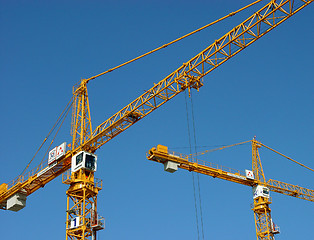 Image showing two cranes against the blue sky