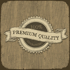 Image showing Vintage label with premium quality text on wooden texture.  Vect