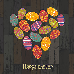 Image showing Easter eggs. Heart shaped on wooden planks background. Vector, E