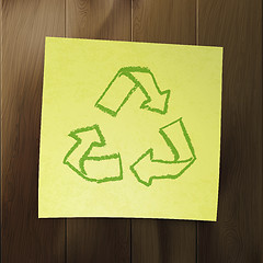 Image showing Recycle symbol on wooden background.