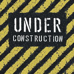 Image showing Under construction message on asphalt background. Vector, EPS8