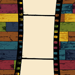 Image showing Film strip on colorful seamless wooden background. Vector, EPS10