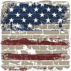 Image showing The American flag against a brick wall.