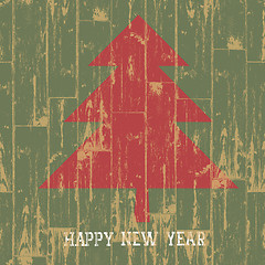 Image showing New year tree symbol with greetings on wooden planks texture. Ve