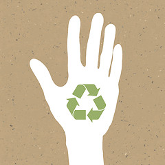 Image showing Reuse sign on hand silhouette on recycled paper. Vector, EPS10