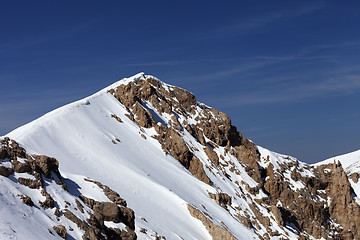 Image showing Top of mountains with snow cornice