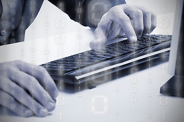 Image showing Man Working at a Computer Keyboard