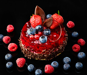 Image showing Cake with fresh berries and chocolate