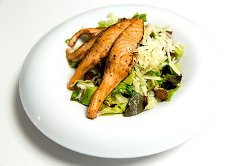 Image showing Grilled salmon steak with herbs and vegetables