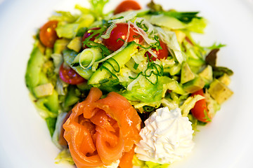 Image showing Salmon with avocado, tomatoes and cream