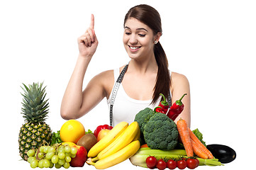 Image showing Young smiling woman with fruits and vegetables