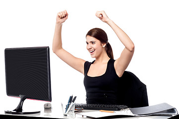 Image showing Excited business woman raising her hands.