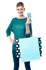 Image showing Girl holding shopping bags and credit card