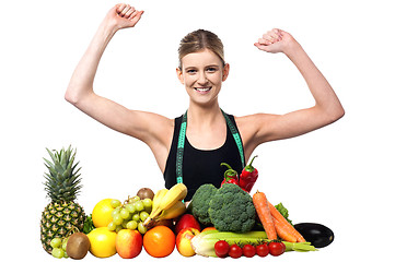 Image showing Happy teenager with fruits and vegetables
