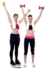 Image showing Two smiling girls working out together