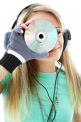 Image showing urban teenage girl in headphones holding cd