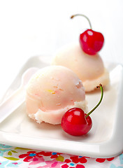 Image showing fruit sorbet decorated with fresh red cherry