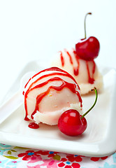 Image showing fruit sorbet decorated with fresh red cherry