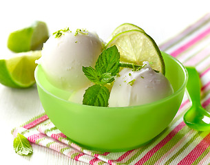 Image showing lemon sorbet decorated with lime slices and mint