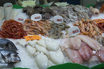 Image showing Fresh seafood fish krivetki, mussels on ice.