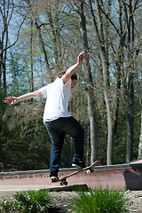 Image showing Skateboarder on a Rail