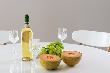Image showing White wine, melon and grapes