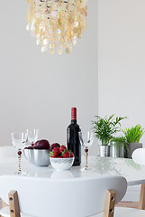 Image showing Elegant table with red wine and fruits