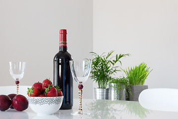 Image showing Red wine, fruits and elegant glasses