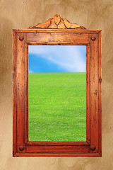 Image showing wood frame with idyllic scene on wall