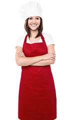 Image showing Young female chef with folded arms