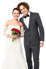 Image showing Lovely newlywed couple posing for a portrait