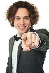 Image showing Handsome man in bowtie pointing you out