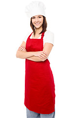 Image showing Young baker woman with folded arms