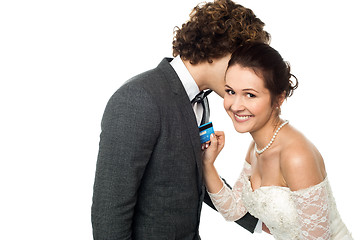 Image showing Groom whispering sweet nothings