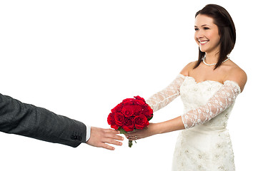 Image showing Bride offering her token of love to the groom