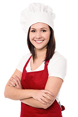 Image showing Cheerful confident young female chef