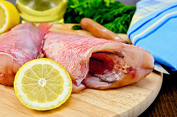 Image showing Fillet of sea bass with lemon and knife